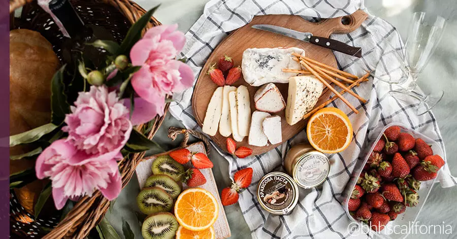 outdoor activities, picnic spread with cheese and fruit