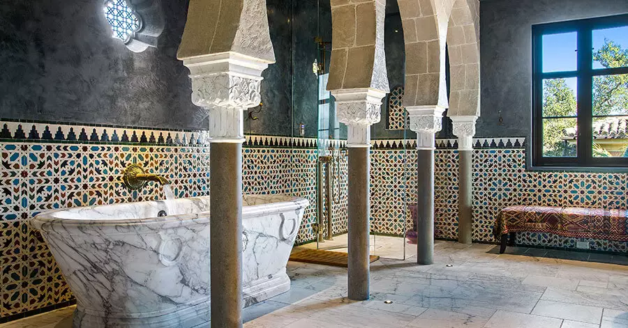 lavish, spa-like bathroom with marble soaking tub