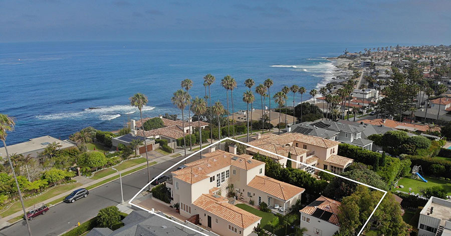 aerial view of La Jolla home perched above the ocean. 