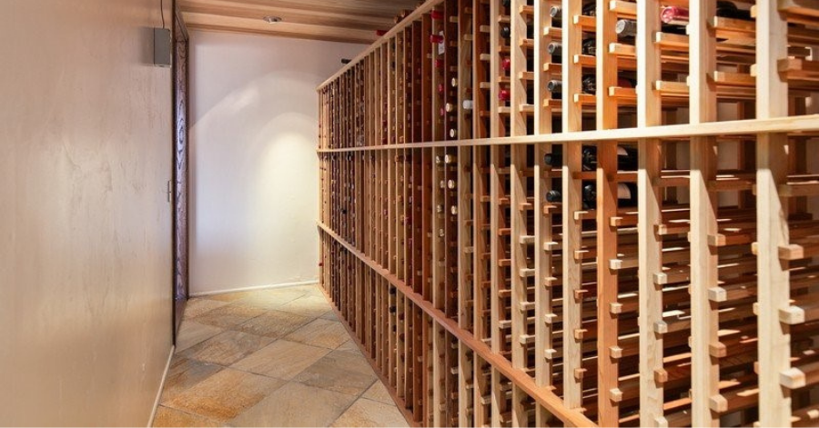 Wine storage with space for 2,200 bottles in light wooden shelves 