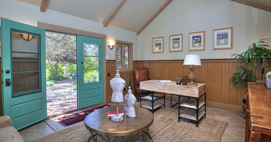 Office and study with large green French doors leading outside