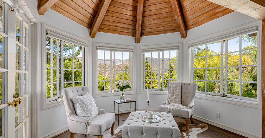 sitting room with large windows showcasing outdoors