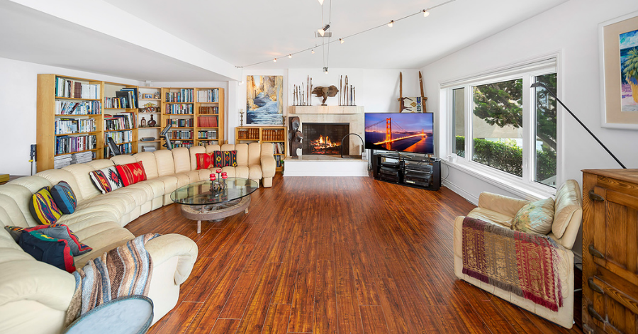 Spacious living room with fireplace and picture window