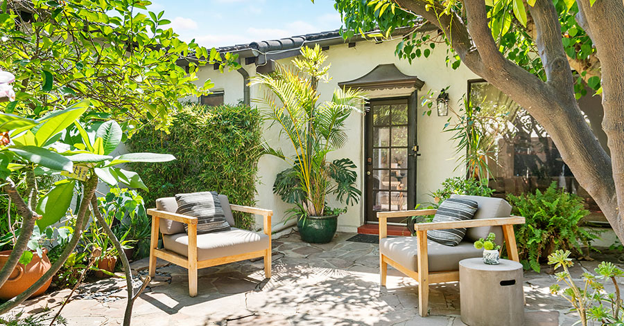 Outdoor patio with lush greenery 