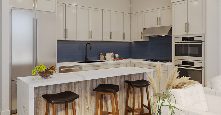 Interior shot of kitchen with large island, bar stools, and high-end appliances