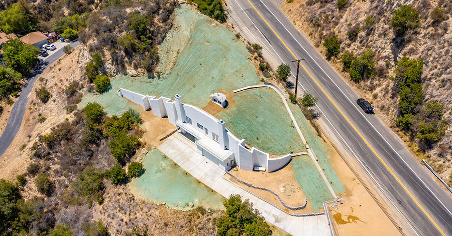 Aerial view of top of underground dome home that has recently been hydro-seeded. 