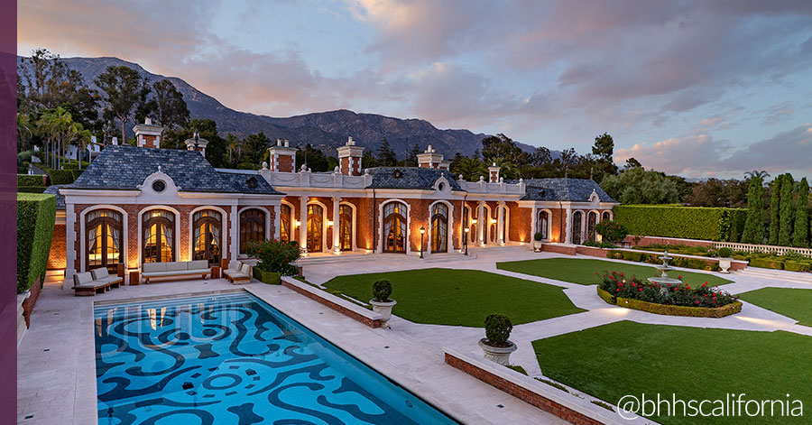 Exterior of Montecito chateau featuring the elegant pool, manicured lawns, and fountain