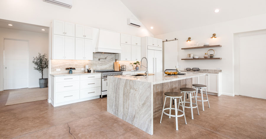 Waterfall kitchen island in bright spacious room