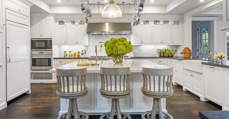 White marble kitchen island in spacious kitchen 