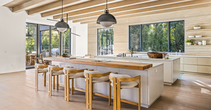 Wood beamed ceiling and modern kitchen with two kitchen islands