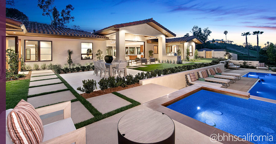 newly built home's backyard with pool