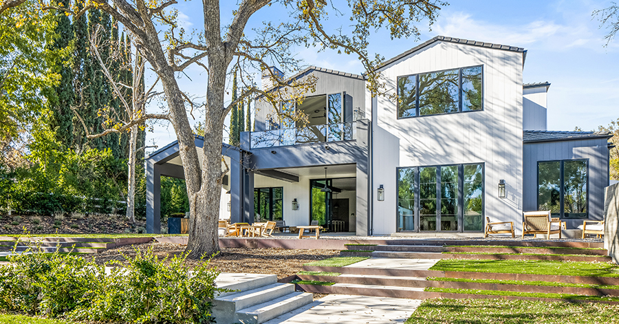 new construction home with white exterior in hidden hills 