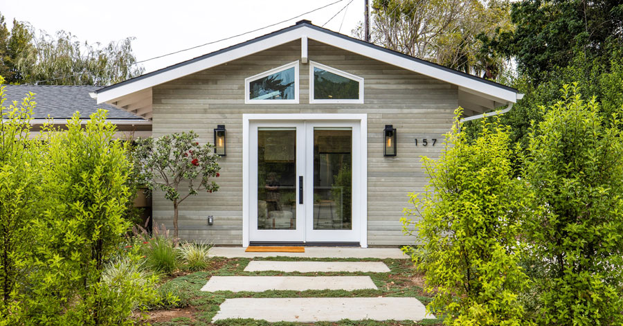 exterior of one of the homes for lease in southern california surrounded by lush green trees