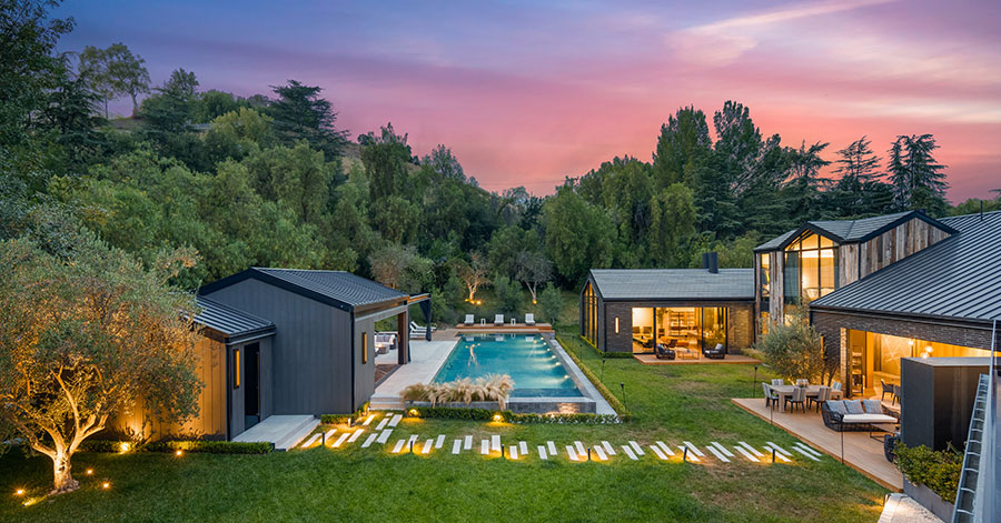 View of 65-foot pool and lush backyard 