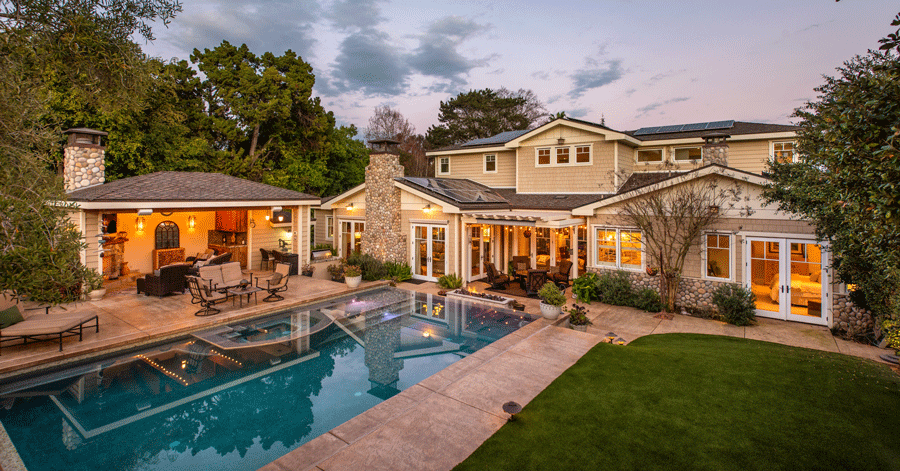 Homes made for outdoor entertaining - backyard with pool and cabana