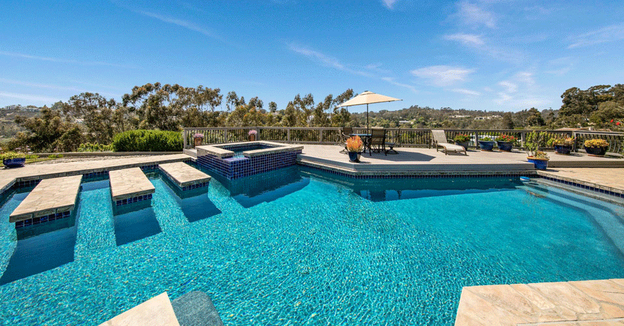 Homes made for outdoor entertaining - Sparkling blue pool and spacious deck 