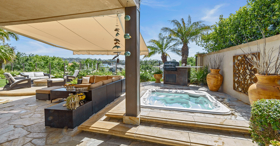 Sunken jacuzzi and covered seating area 