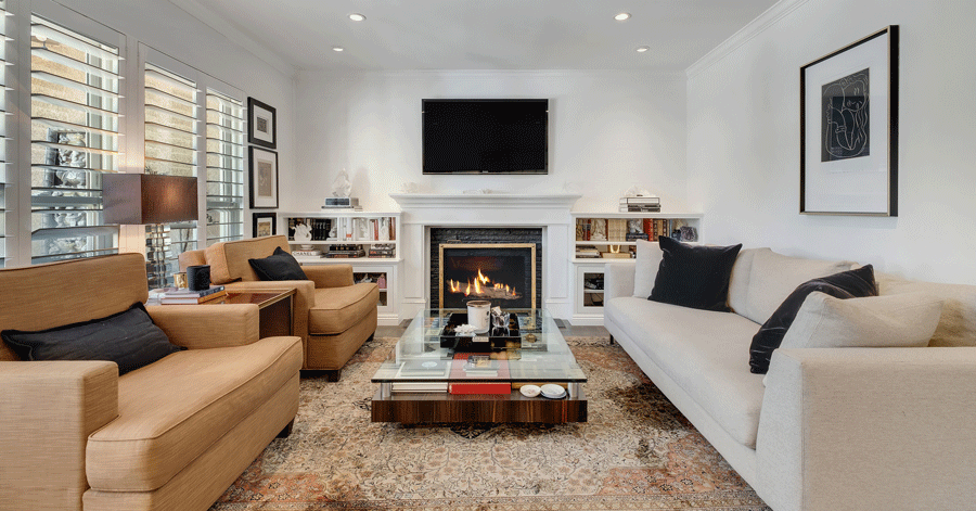 Fireplace flanked by two bookshelves 