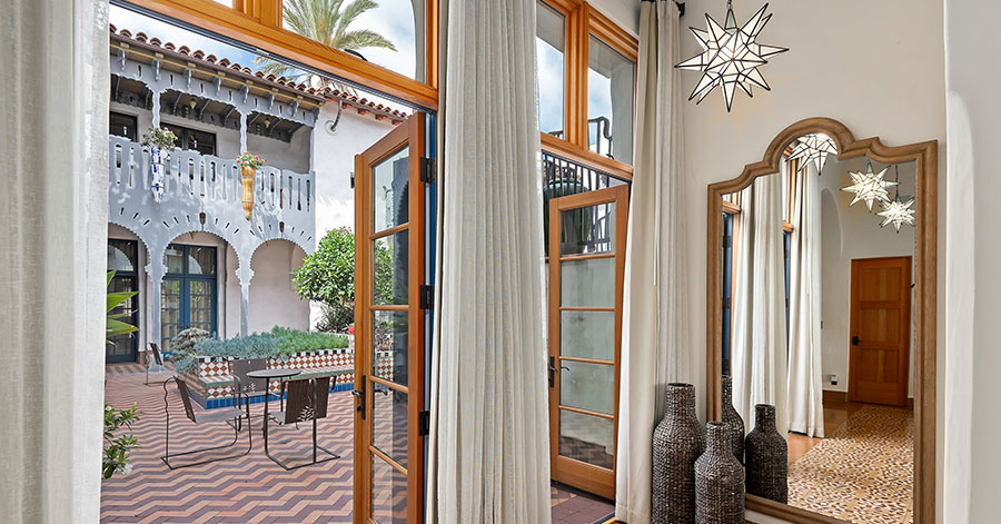 interior of luxury condo looking out at el andaluz courtyard 