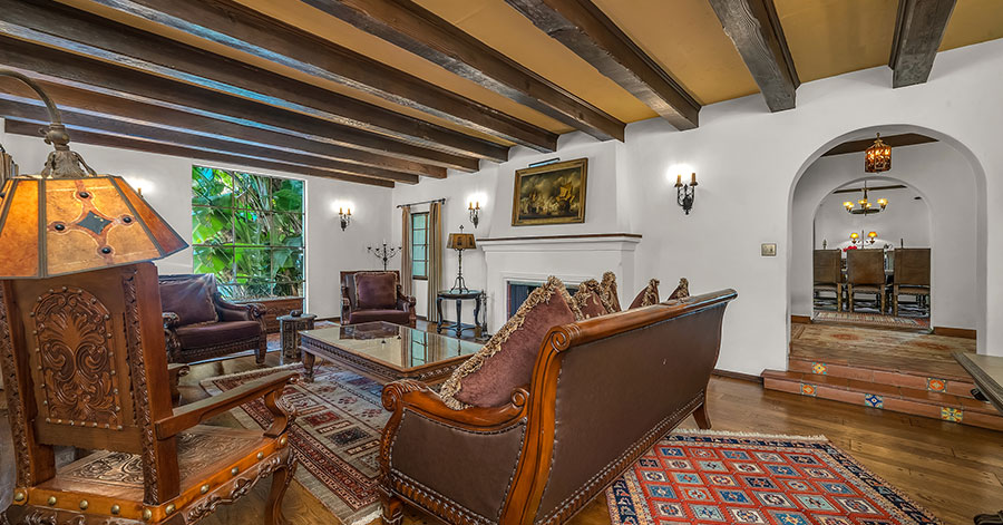 Spanish-Revival by Harry Hayden Whiteley spacious living room with beamed ceilings 