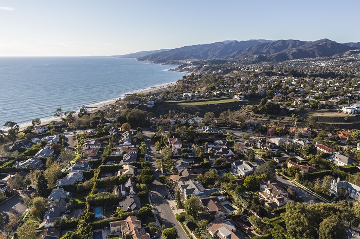 Aerial view of houses that overlook the ocean in Pacific Palisades, California