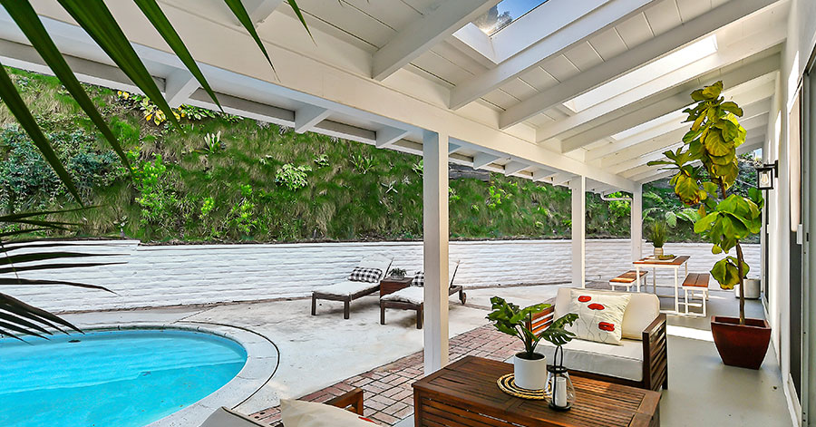 Backyard with covered patio and pool 