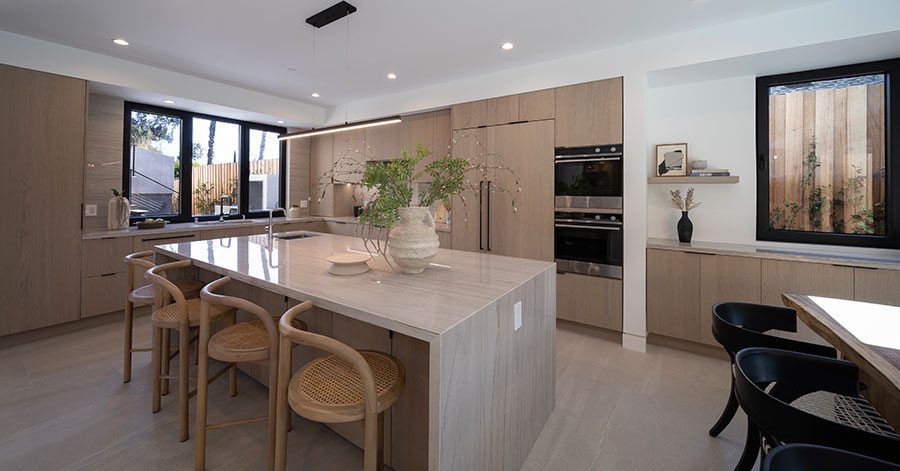 Shot of kitchen featuring the waterfall countertop island 