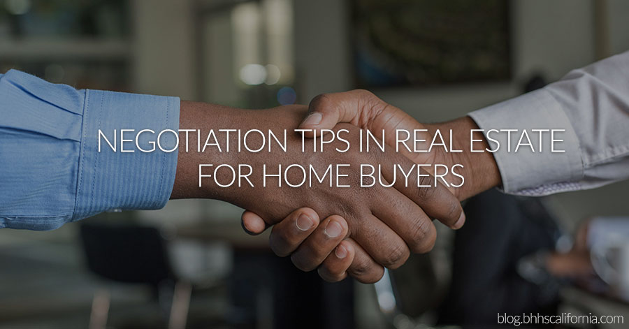 close up of two men's hands shaking and the text: Negotiation Tips in Real Estate for Home Buyers 